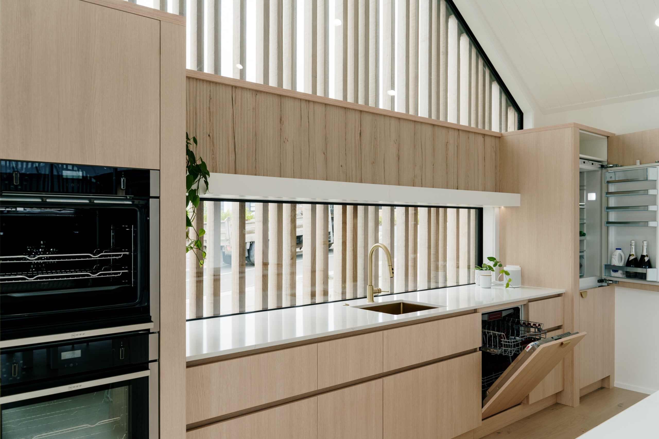 smart wooden designed kitchen with lights in paerata rise